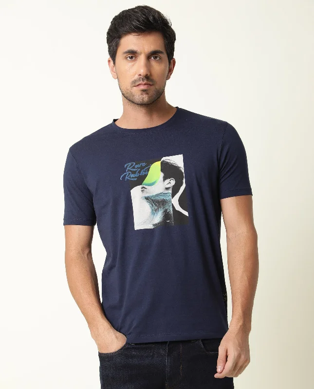 Men's Shirts with Logo EmbossmentsRare Rabbit Men's Minx Navy Cotton Lycra Fabric Crew Neck Half Sleeves Regular Fit Graphic Print T-Shirt