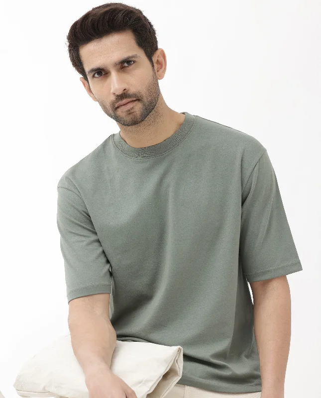 Men's Shirts with CollarsRare Rabbit Men's Qlo Dusky Olive Cotton Polyester Fabric Short Sleeve Crew Neck Oversized Fit Solid T-Shirt