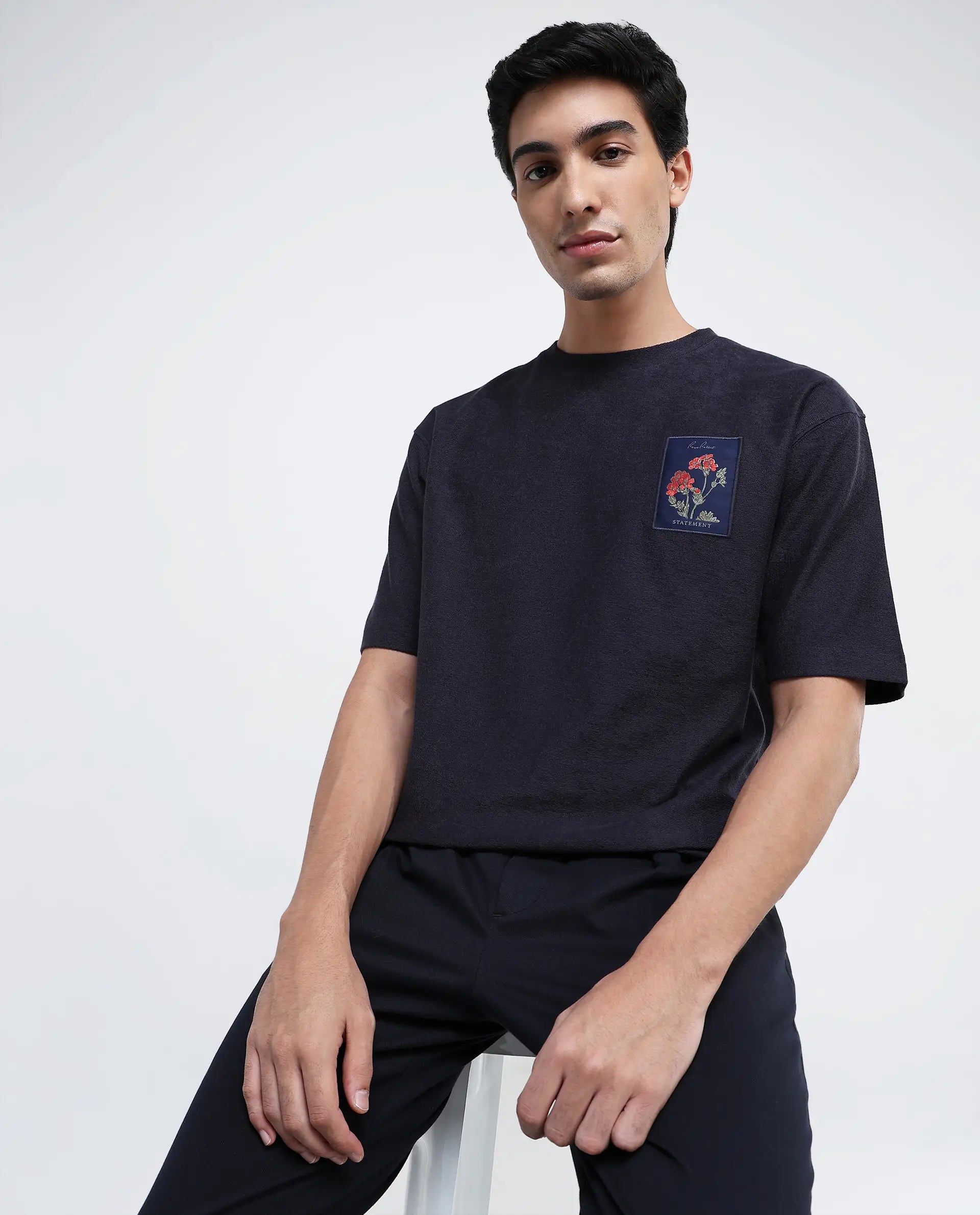 Men's Shirts with Rounded HemlinesRare Rabbit Men Loopet-1 Navy Cotton Lycra Fabric Half Sleeves Floral Print Pocket Detailing Oversized Fit Solid T-Shirt